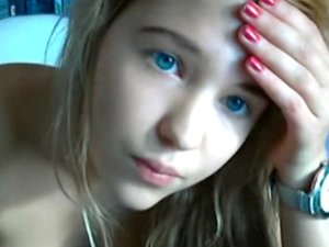 Blue-eyed teen cam chick teasing and smoking